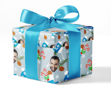 A custom wrapping paper with a blue and white pattern, including a photo and text personalization, tied with a blue ribbon.