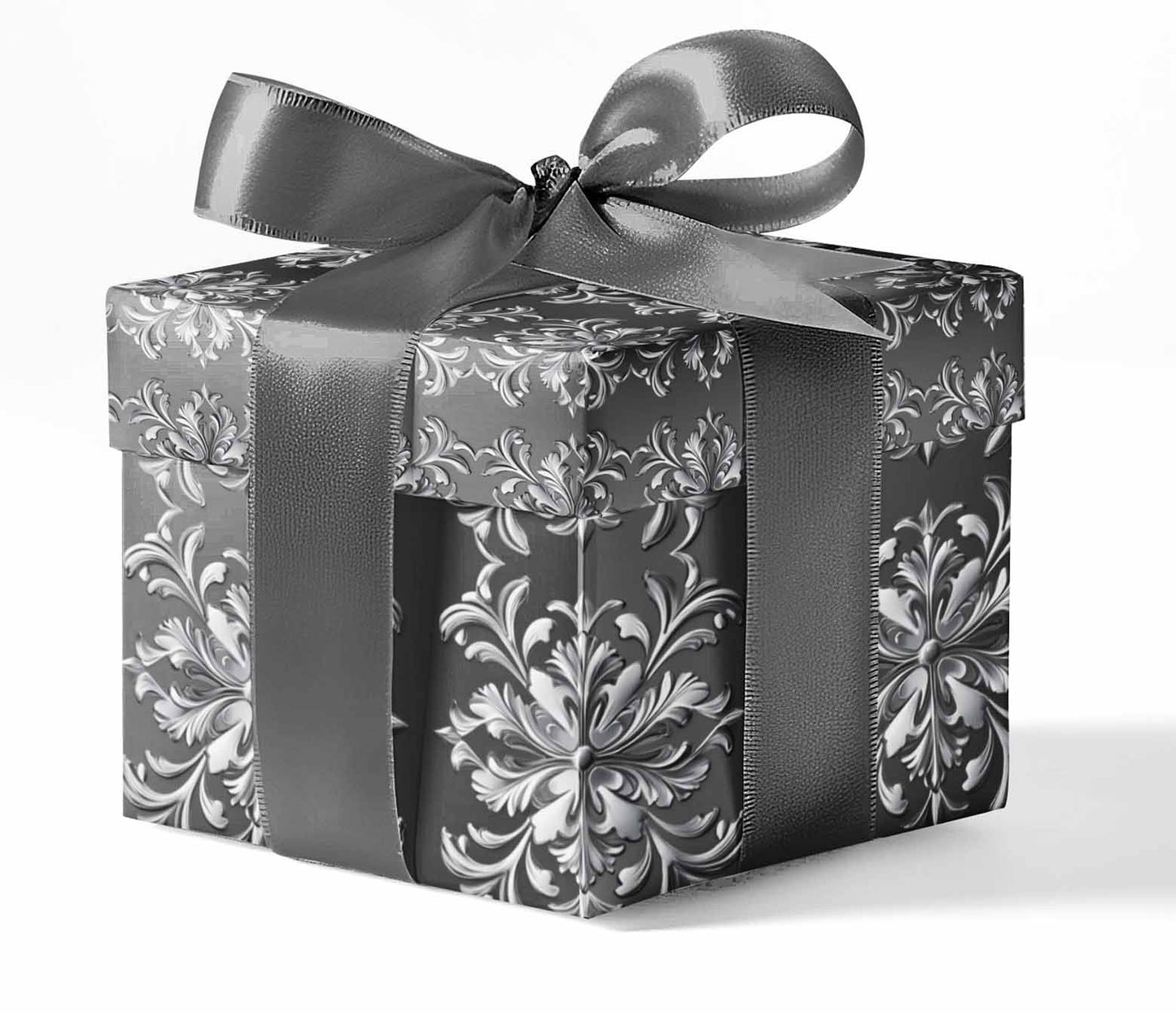 A gift box wrapped in black and white floral patterned wrapping paper with a gray ribbon.