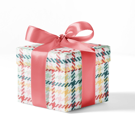 A gift box wrapped in custom plaid wrapping paper with a pink ribbon.