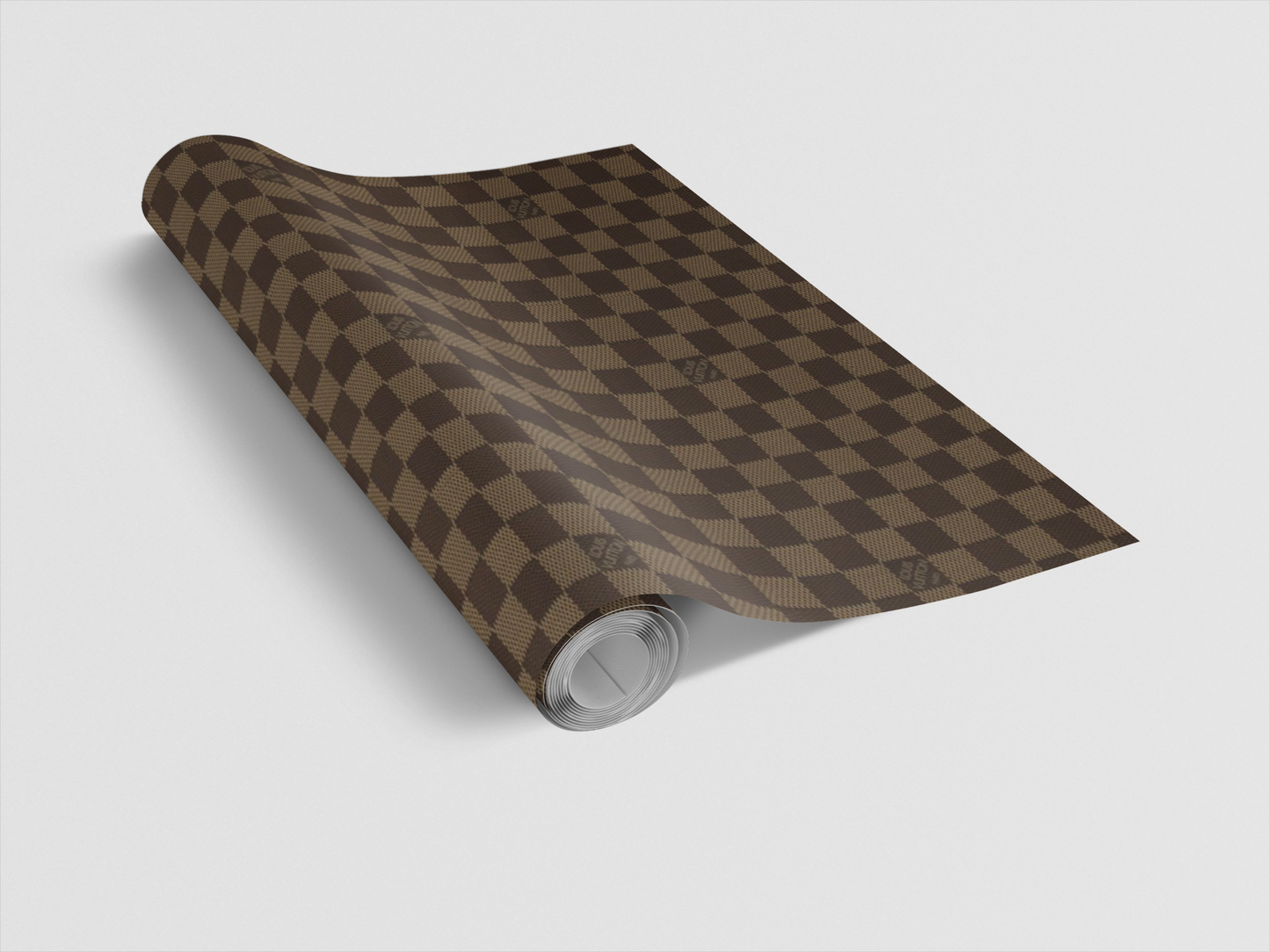 Roll of red wrapping paper with a white pattern on a light gray background