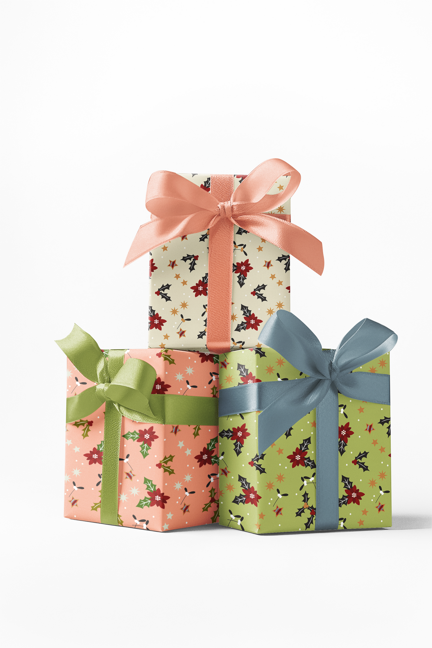 Three gift boxes wrapped in floral custom wrapping paper with different colors of ribbon.