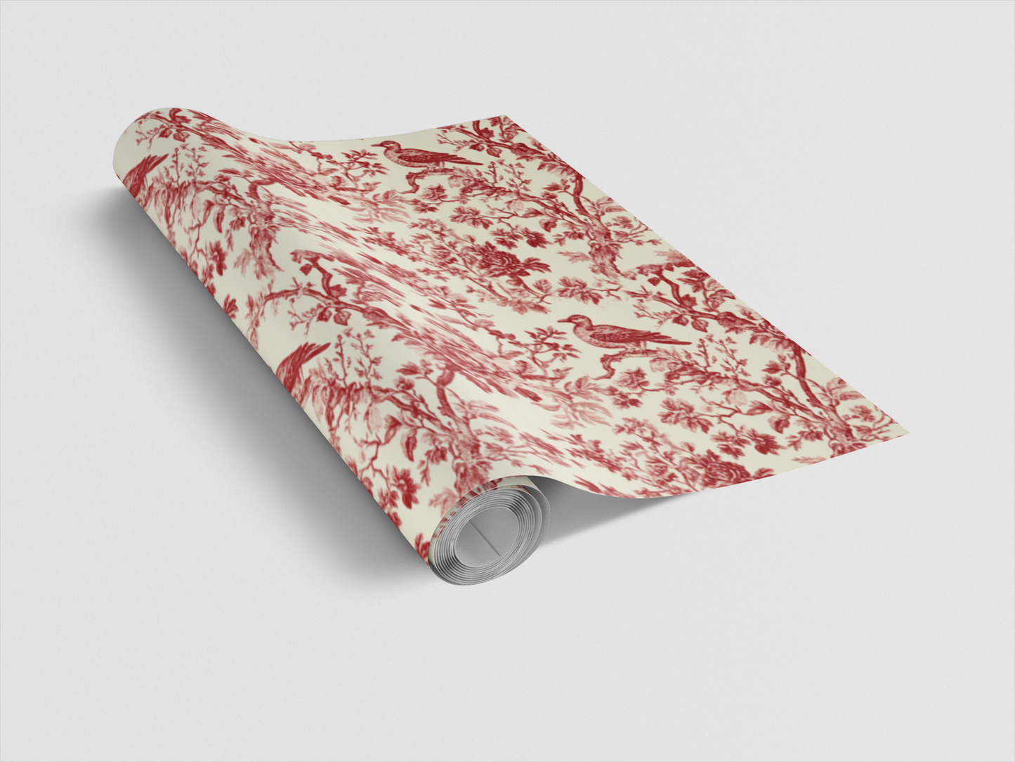 Roll of red and white floral patterned paper on a light gray background
