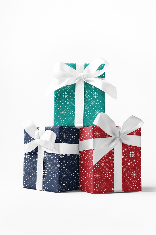 Three gift boxes wrapped in custom Christmas paper with red, blue, and green dots pattern, respectively, tied with white ribbons.