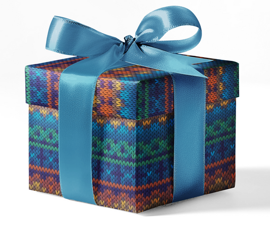 A gift box wrapped in custom wrapping paper with a geometric pattern, tied with a blue ribbon.