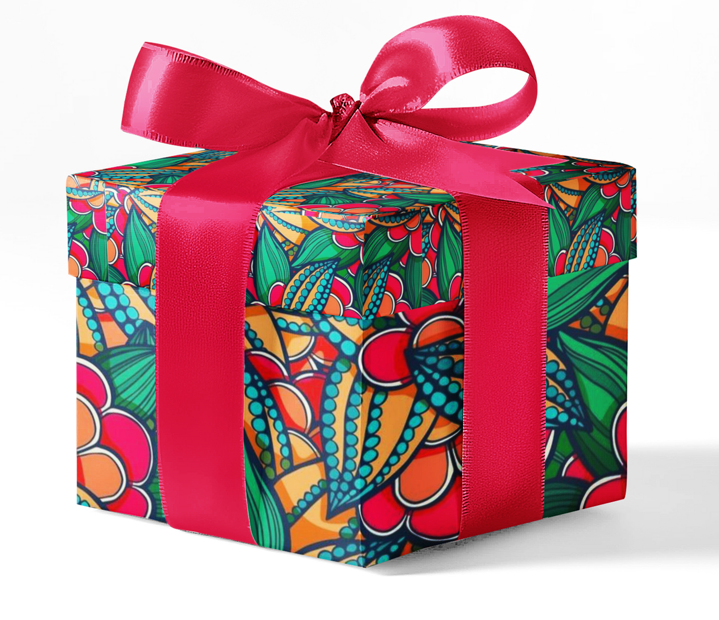A gift box wrapped in custom wrapping paper with a colorful floral pattern and a bright red ribbon.