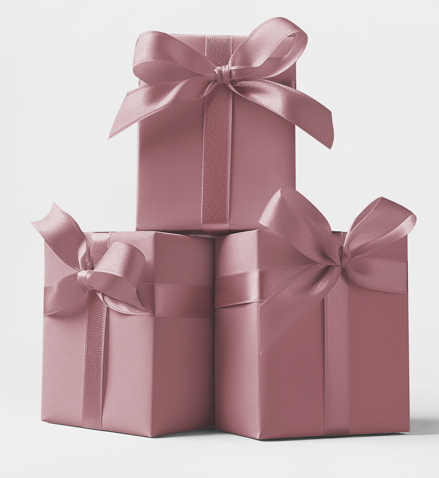 Three rectangular gift boxes in mauve color with black bows on top, stacked in a pyramid shape. custom wrapping paper available at CustomMyPrints.com.
