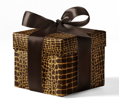 A box wrapped in animal gator print wrapping paper with a brown ribbon bow on top.