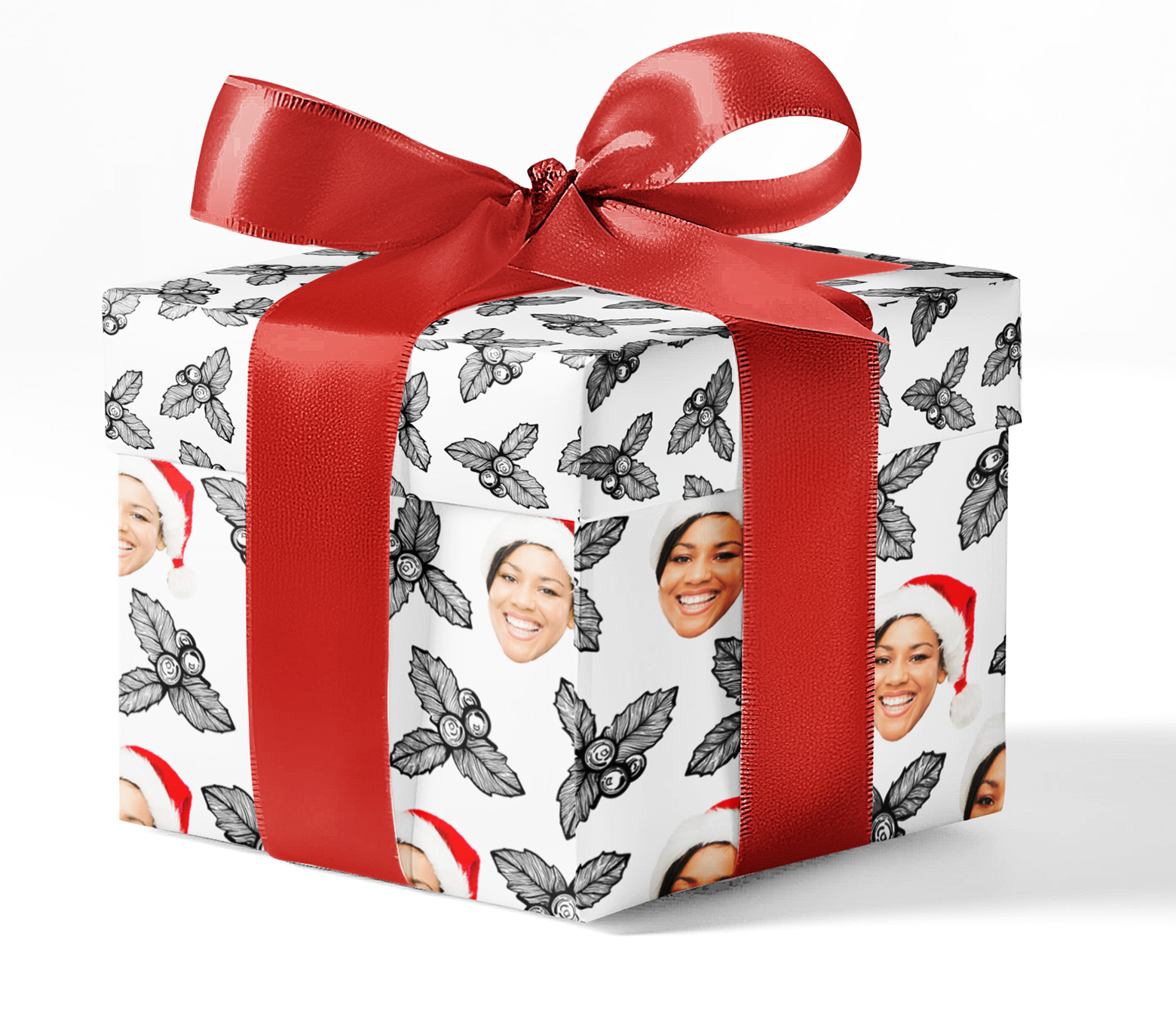 A gift box wrapped in black and white Holly Bunch custom wrapping paper with a red ribbon.