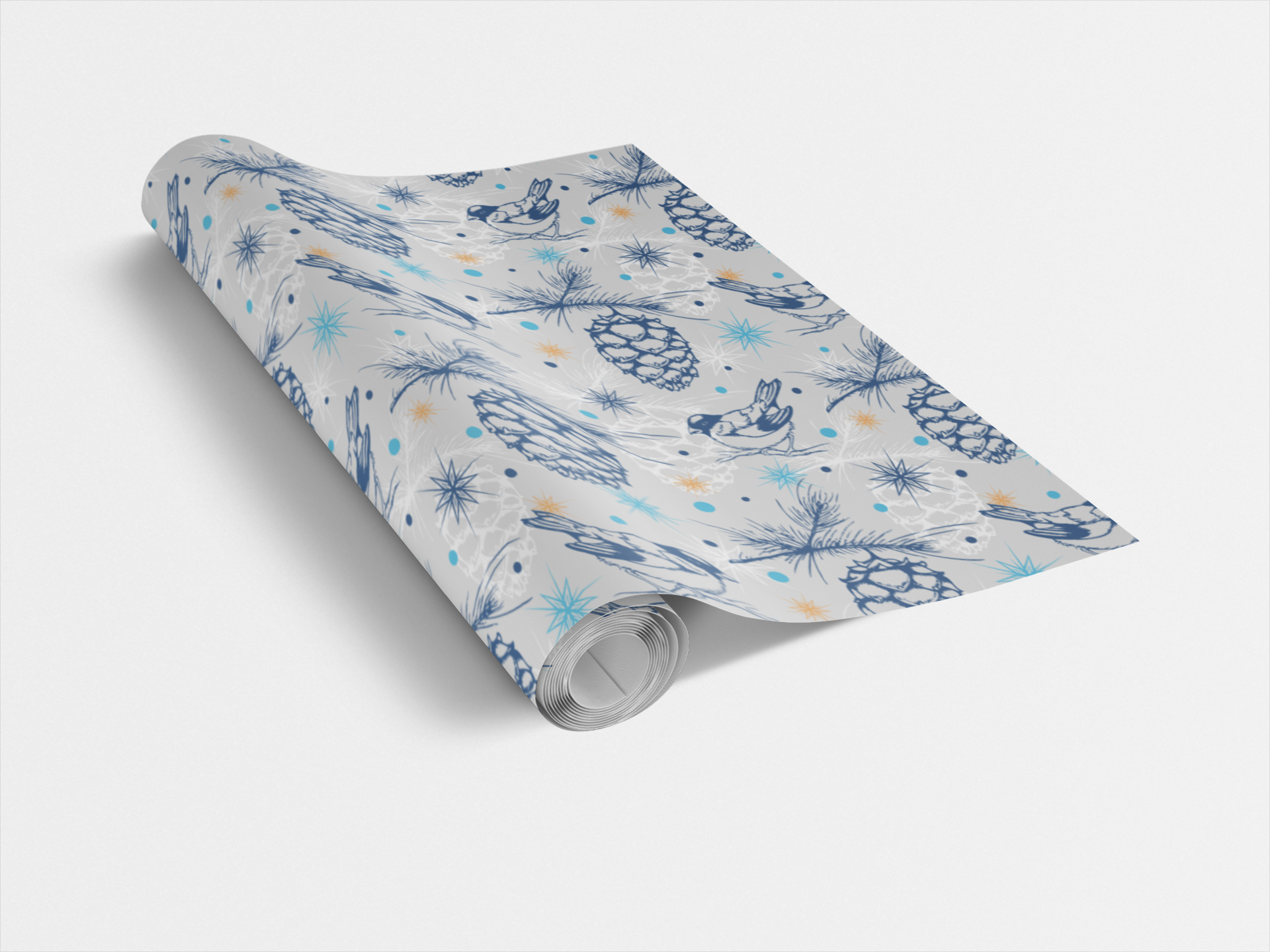 Roll of winter-themed wrapping paper with blue and orange designs on a white background