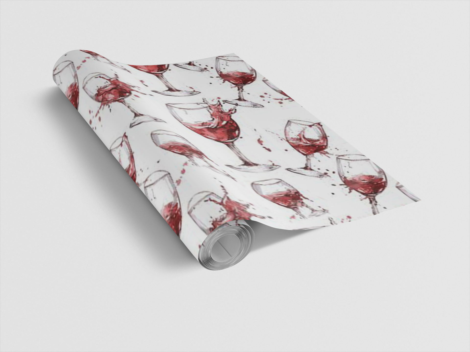 Roll of wrapping paper with wine glass design on a white background