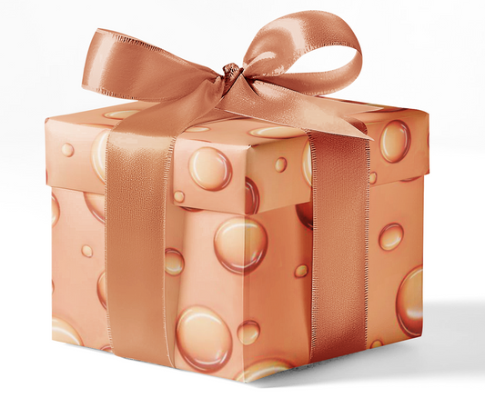 A gift box wrapped in orange wrapping paper with a bubble pattern and tied with a brown ribbon.