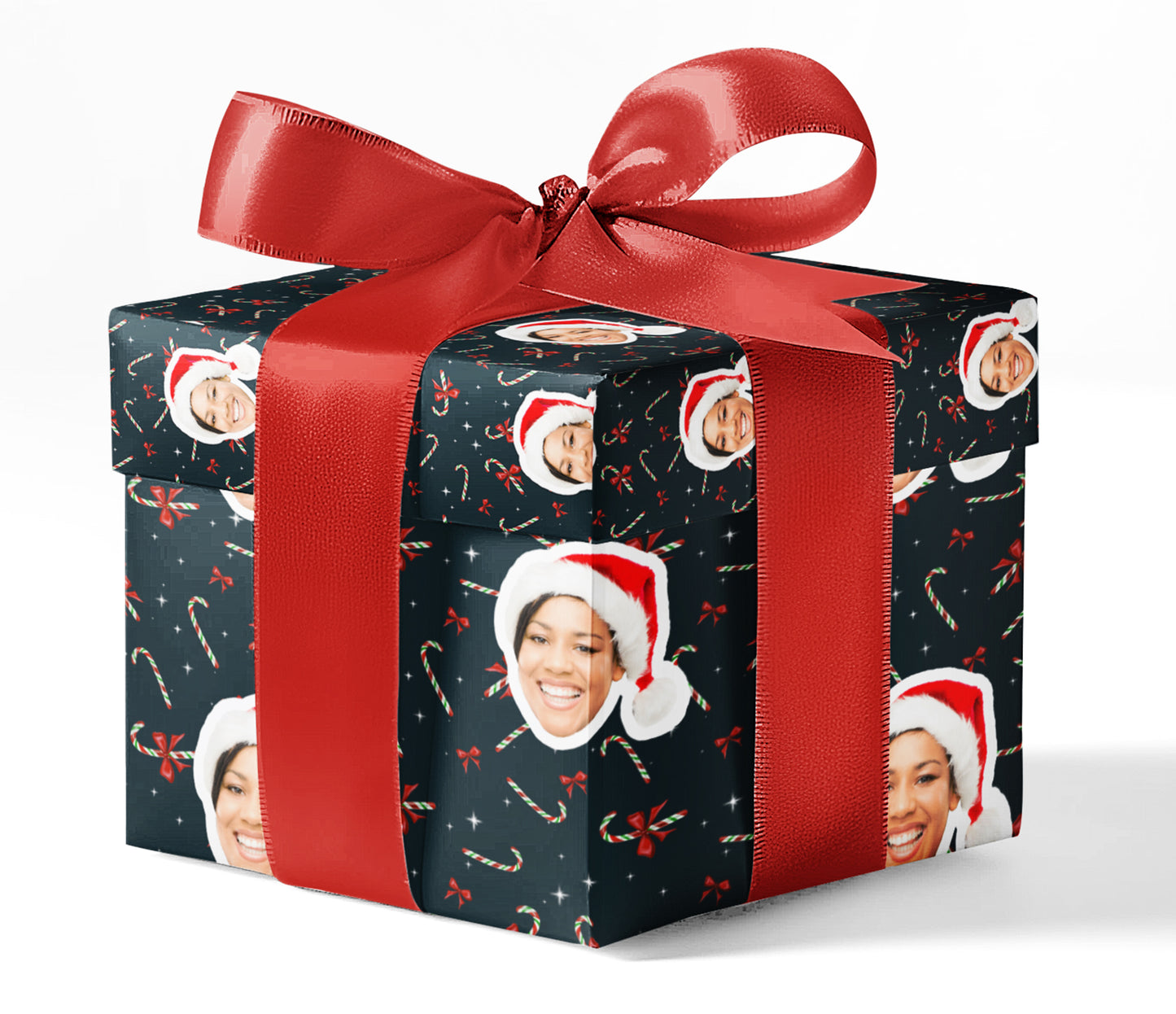A gift box wrapped in custom wrapping paper with a pattern of candy canes and Santa hats, tied with a red ribbon.
