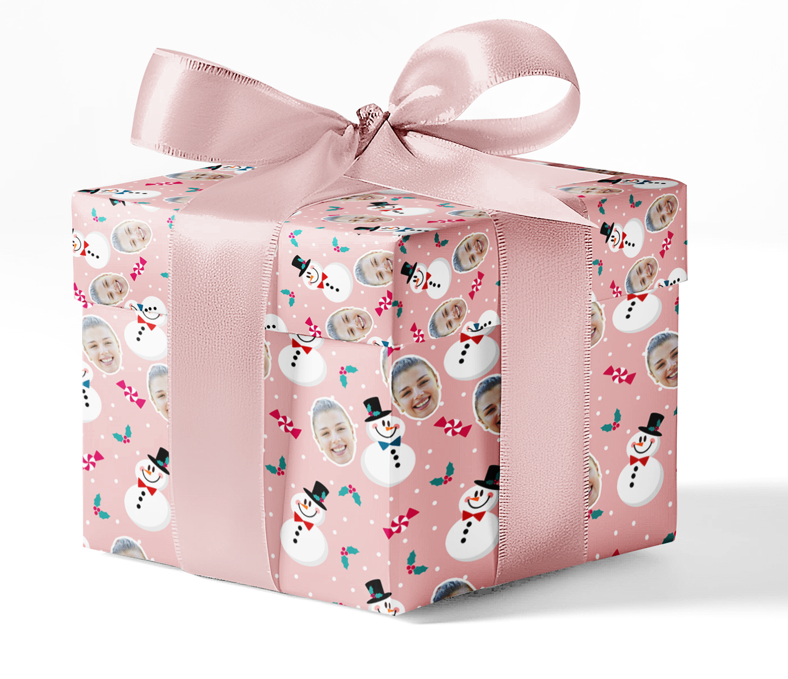 A gift wrapped in custom wrapping paper with a snowman pattern, adorned with a pink ribbon.