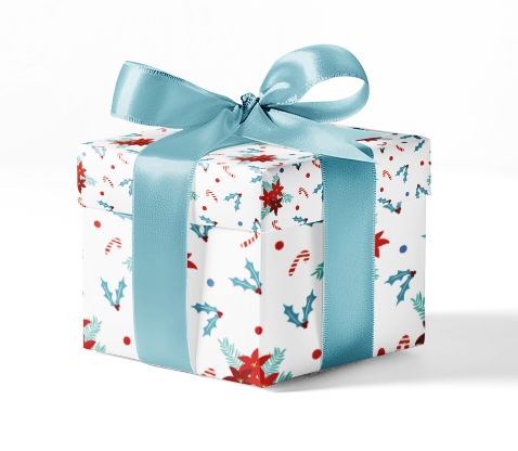A gift box wrapped in custom wrapping paper with a Christmas pattern, including candy canes and holly, and tied with a blue ribbon.