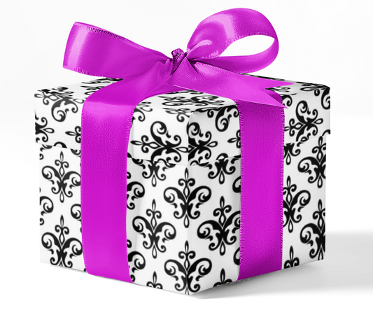 Elegant gift box wrapped in black and white damask custom wrapping paper, tied with a vibrant purple satin ribbon