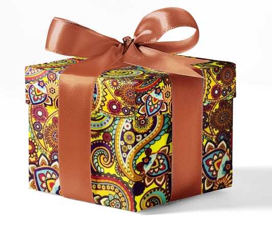 A gift box wrapped in custom BoHo print wrapping paper with a brown ribbon.