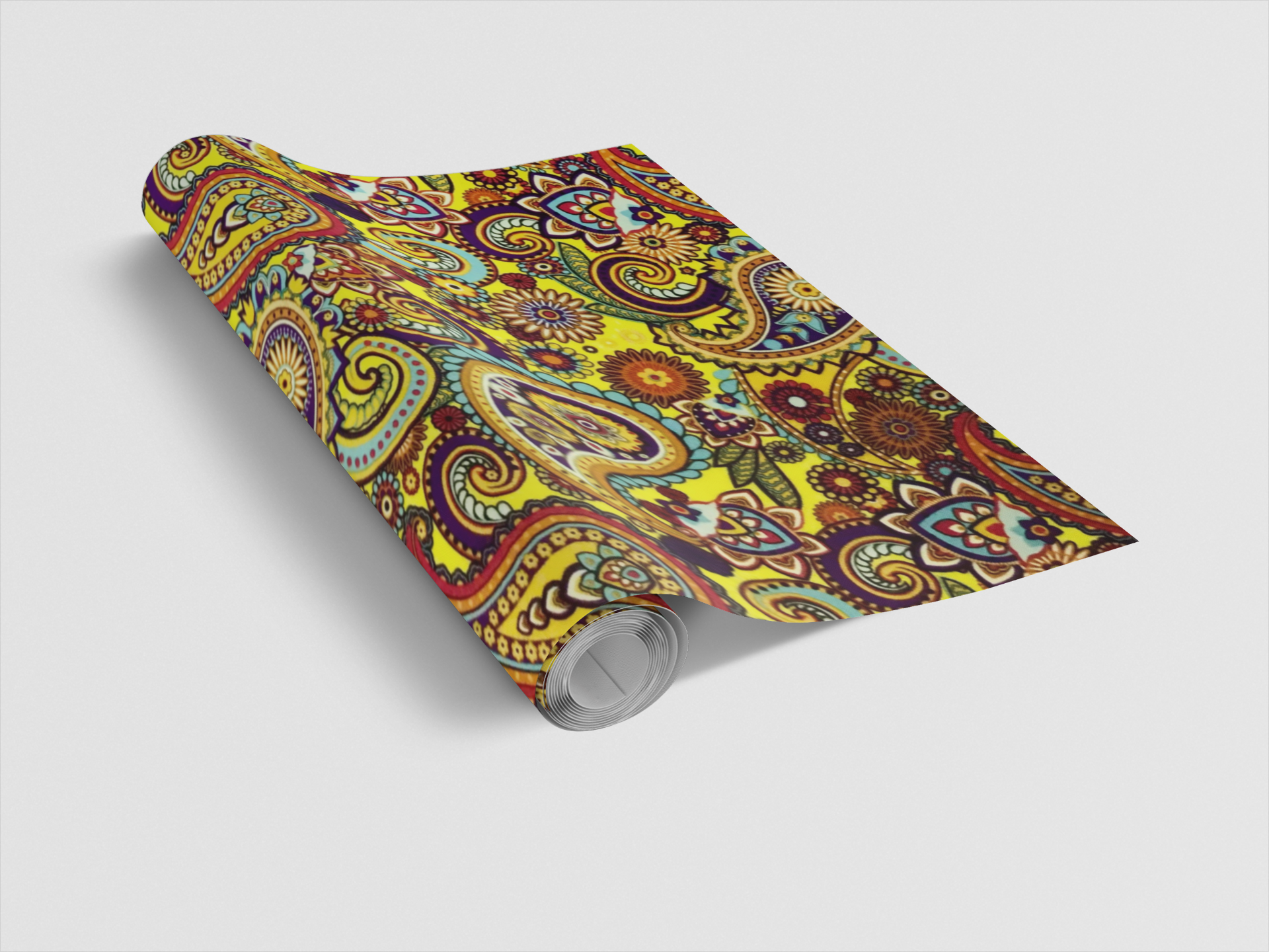 Colorful paisley-patterned yoga mat on a light gray background