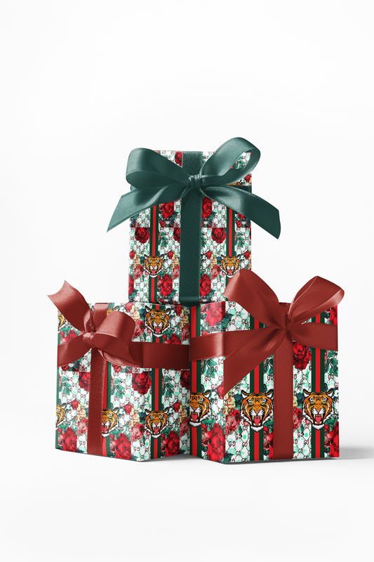 Stacked gift boxes wrapped in custom wrapping paper with a tiger pattern and Christmas-themed motifs, tied with a red ribbon.