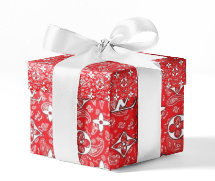 A gift box wrapped in custom Louis Vuitton red bandana pattern wrapping paper with a white ribbon.