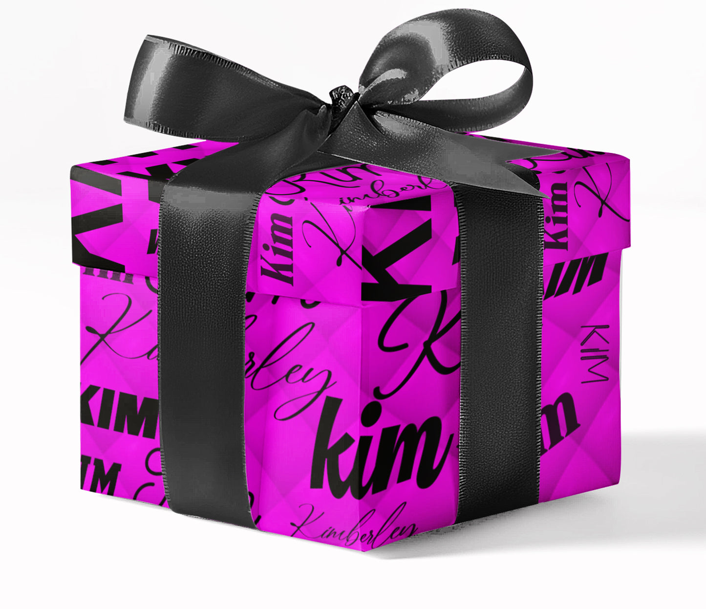 Pink gift box with black ribbon and 'kim' branding on a white background