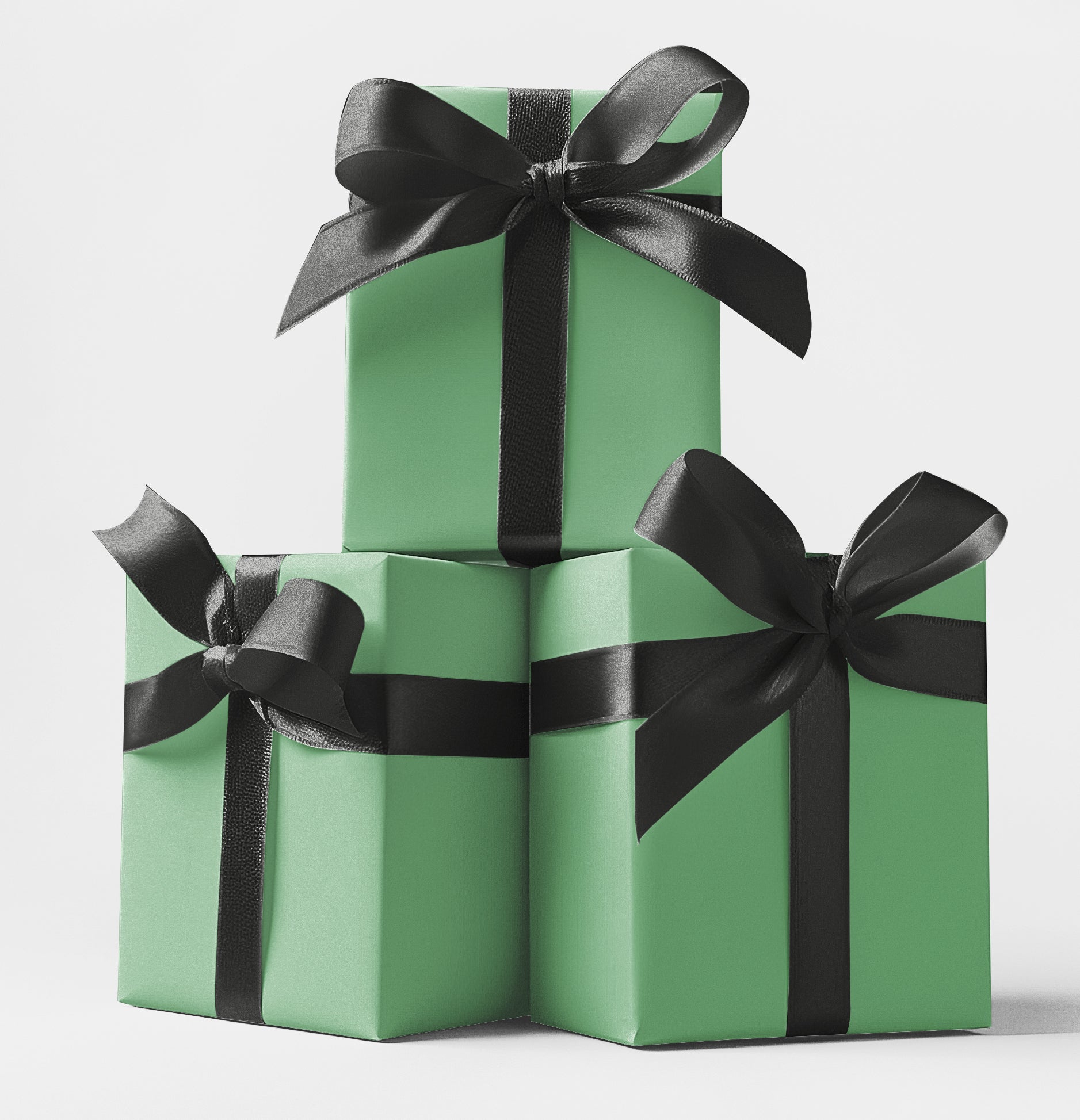 Three stacked gift boxes wrapped in green custom wrapping paper with sleek black satin ribbons – premium wrapping available at CustomMyPrints.com.