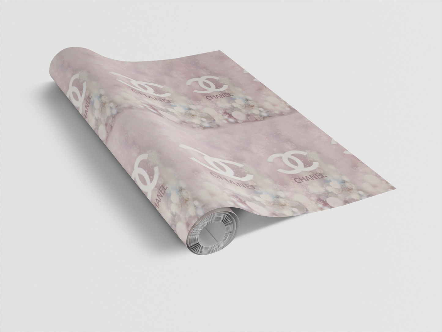 Roll of wrapping paper with a floral pattern and brand logo on a light gray background