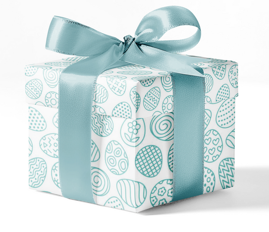 A gift box wrapped in custom wrapping paper with a blue pattern and a blue ribbon bow on top.