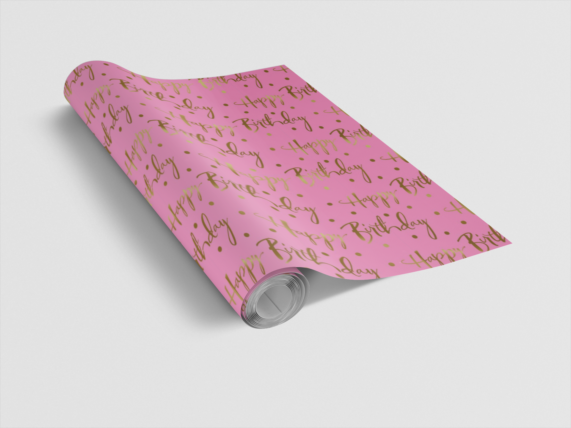 Roll of pink birthday-themed wrapping paper with gold text on a white background
