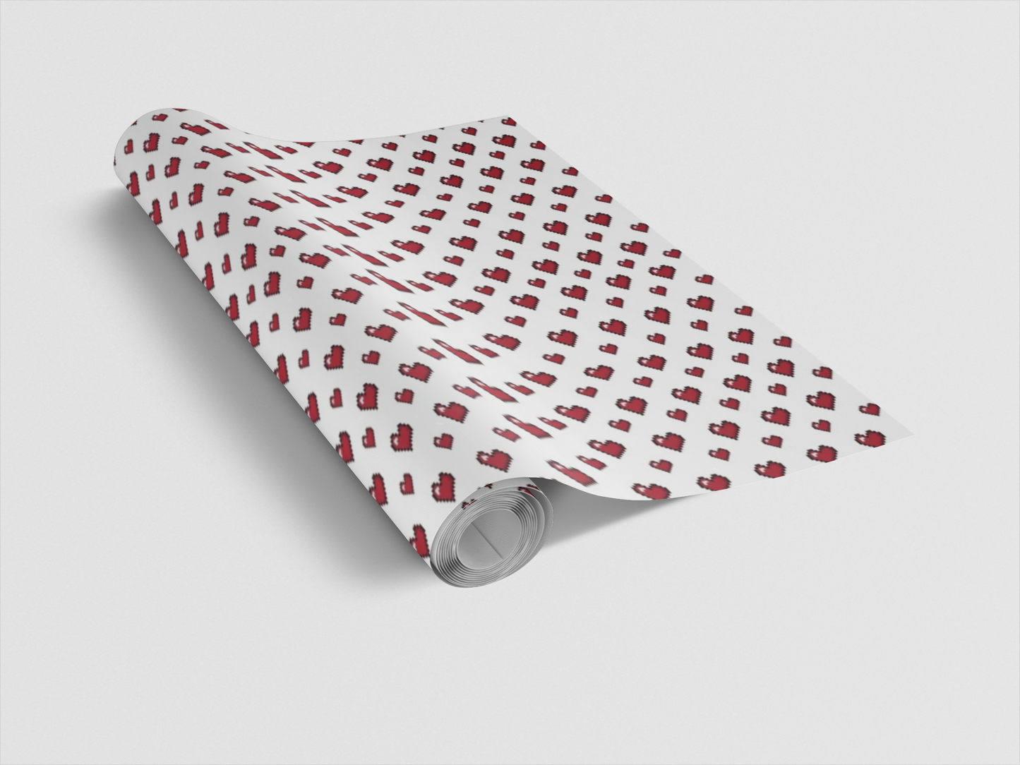 Roll of wrapping paper with red pattern on a white background
