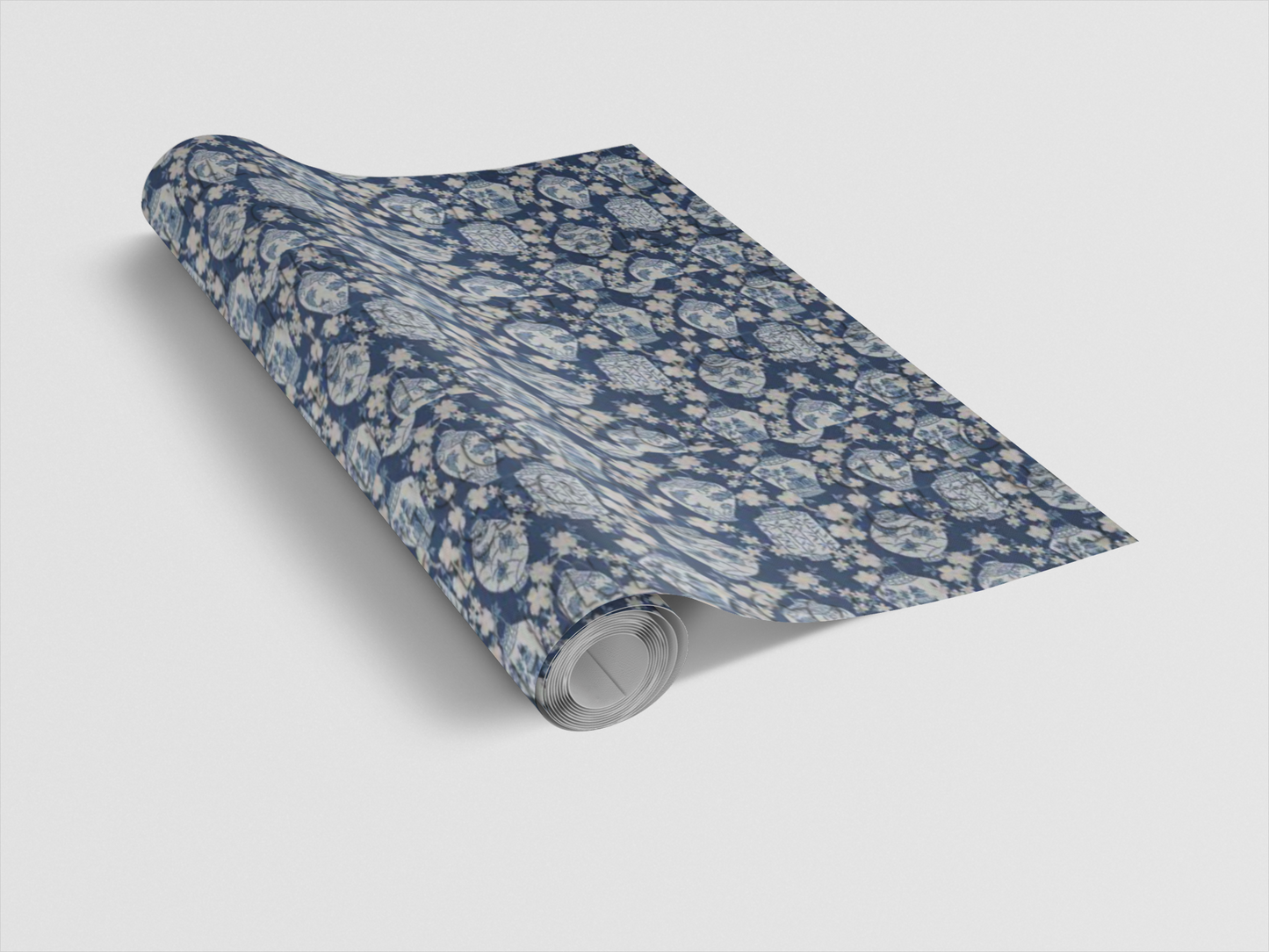 Roll of blue floral patterned paper on a white background