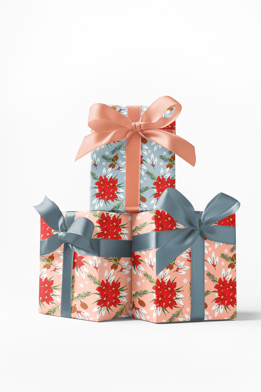 Stack of three custom wrapped gifts with floral patterned wrapping paper and blue and orange ribbons.