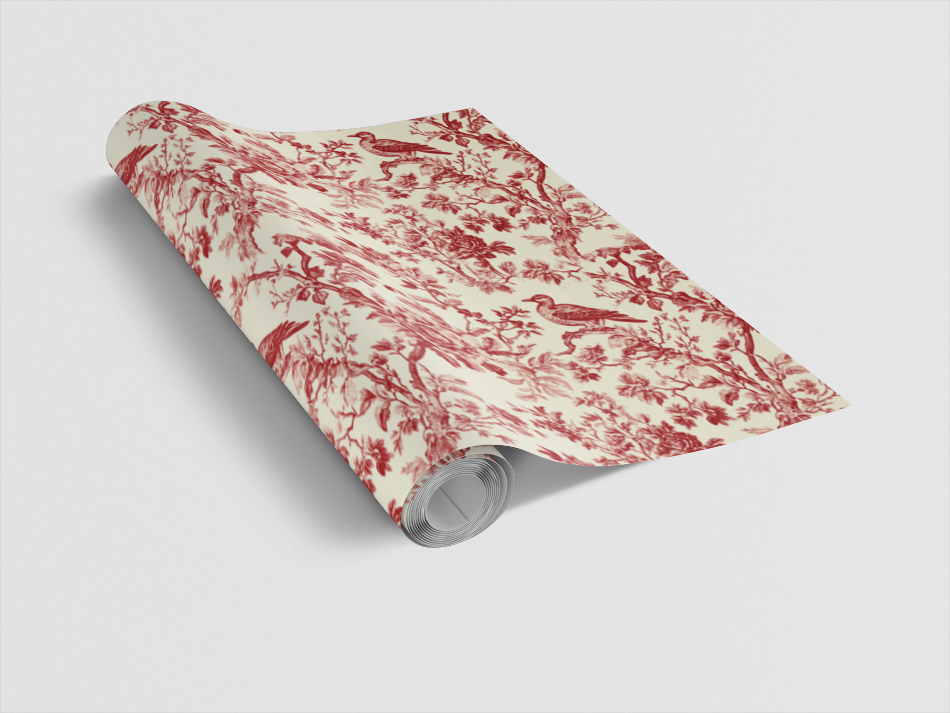 Roll of red and white floral patterned paper on a light gray background