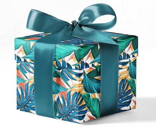 A gift box wrapped in custom wrapping paper with a tropical leaf pattern and tied with a blue ribbon.