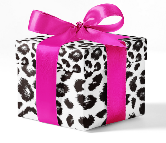 A gift box wrapped in animal print wrapping paper with a pink ribbon.