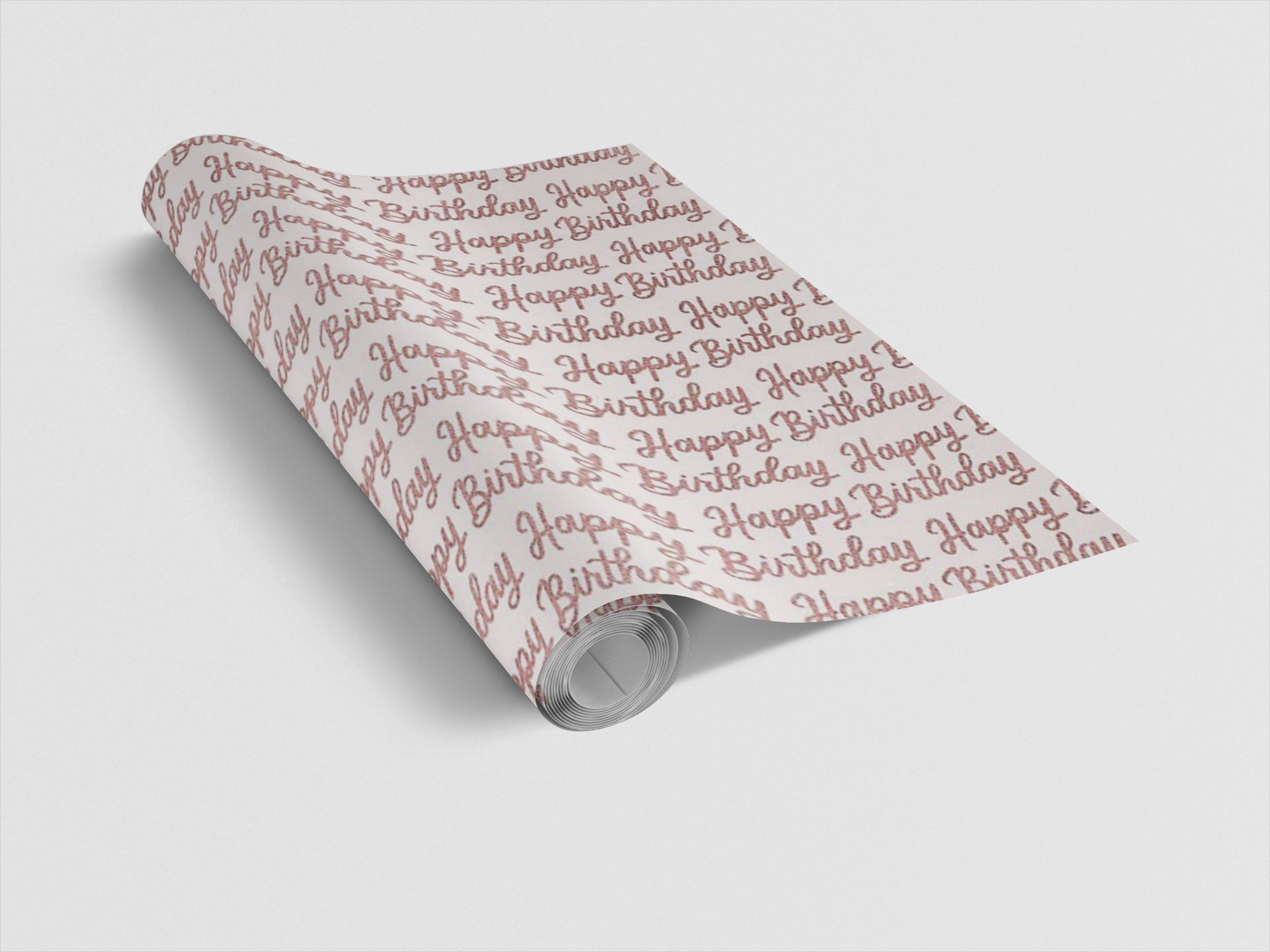 Roll of wrapping paper with 'Happy Birthday' text on a light gray background